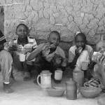 Rural kids sharing bread